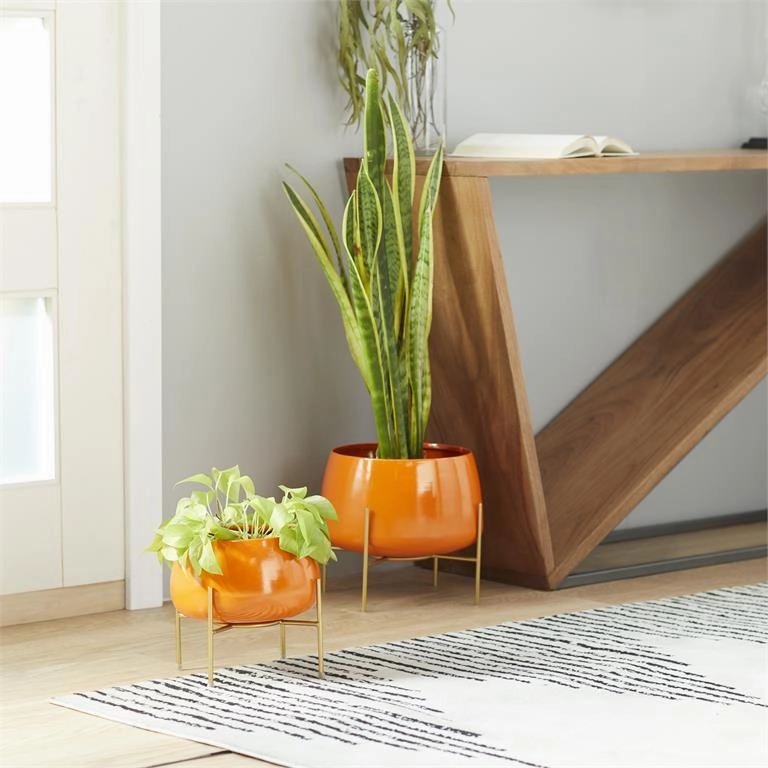 ORANGE METAL INDOOR OUTDOOR PLANTER WITH REMOVABLE STAND